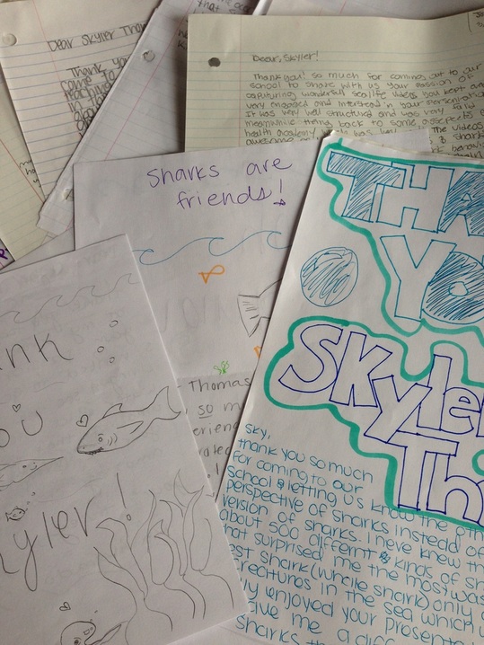 Students express their appreciation to Skyler Thomas of learning more about sharks. 