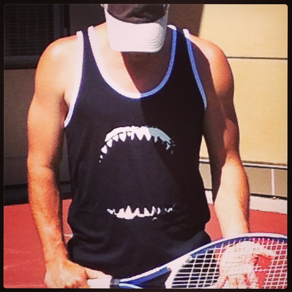 Sports jersey style tank top with great white shark jaws on the front and jersey number and the word 